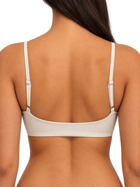 Back view of Ninety Nine off-white crop top with slim adjustable straps and breathable stretch nylon fabric