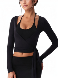 Woman wearing the Wrap Cover-Up — black long-sleeve wrap top with a deep V front and waist ties.