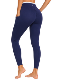 Ninety Nine navy high-rise leggings with side pockets and ruched back detail worn by a model from the back view
