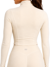 Ninety Nine Vanilla Sculpt three-piece set featuring a beige long-sleeve zip-up jacket and high-waisted leggings.