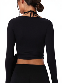 Ninety Nine black long-sleeve wrap cover-up with a tie-waist design, shown from the back.