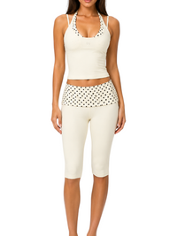Ninety Nine Butter Dot set featuring a butter-colored halter top and capri leggings with black polka-dot accents.