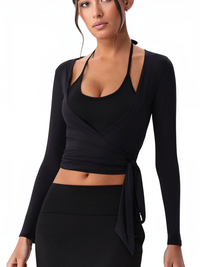 Ninety Nine black long sleeve wrap cover-up with deep V-neck and adjustable waist ties worn over a matching top