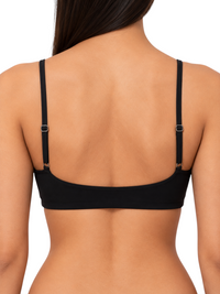 Back view of a Ninety Nine black crop top with slim adjustable straps on a model against a white background