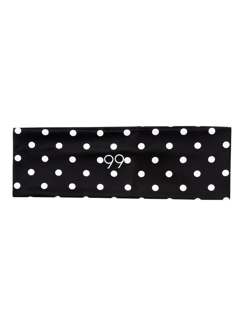 Ninety Nine wide non-slip headband in black with white polka dots and centered logo