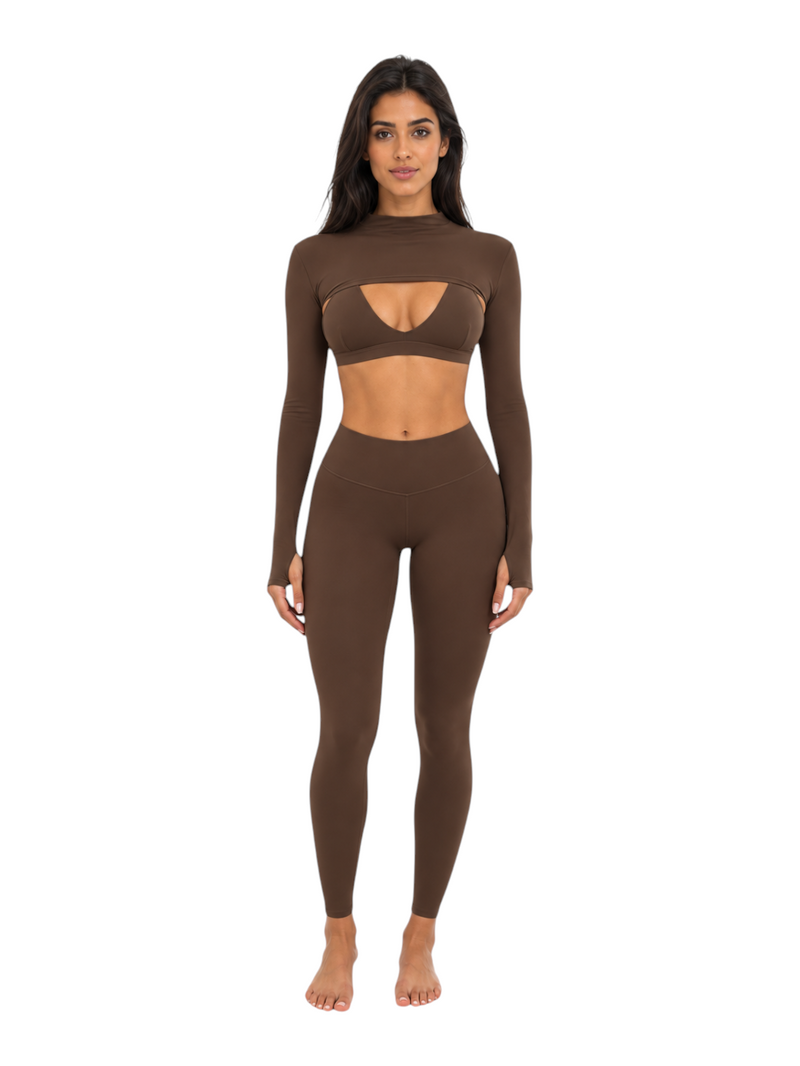Ninety Nine Cocoa Cutout Set featuring a long-sleeve crop top with chest cutout and high-waisted leggings in brown.