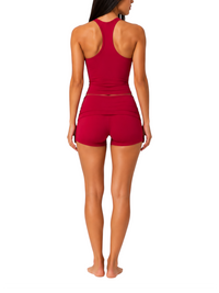 Ninety Nine Cherry Pulse set featuring a racerback tank top and matching shorts in a smooth matte red finish.