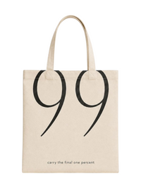 Ninety Nine beige canvas tote bag with large black 99 graphic and carry the final one percent text
